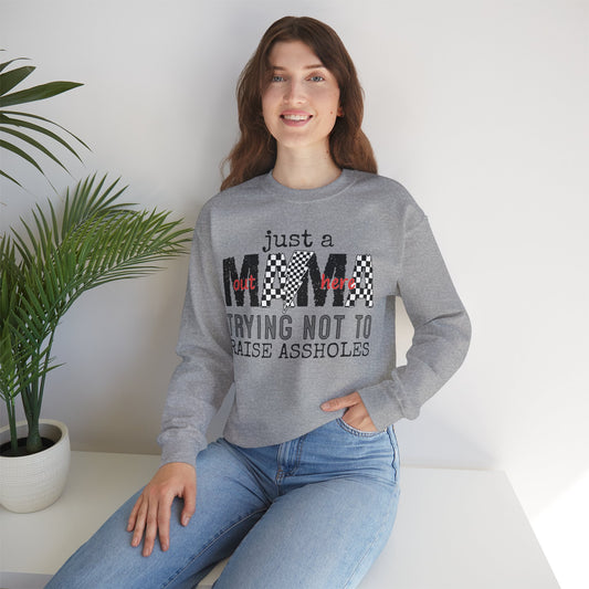 Just A Mama Out Here Trying Not To Raise Assholes Heavy Blend™ Crewneck Sweatshirt